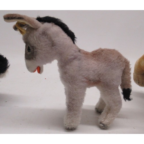 279 - 1950s Steiff donkey, a small plush basset hound, possibly Steiff, and three others similar