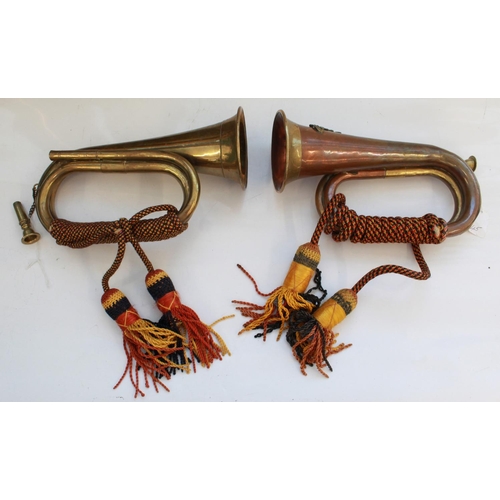 1406 - Pair of military bugles. Both with mouth pieces, bugle cords and tassels, one with The Royal Artille... 