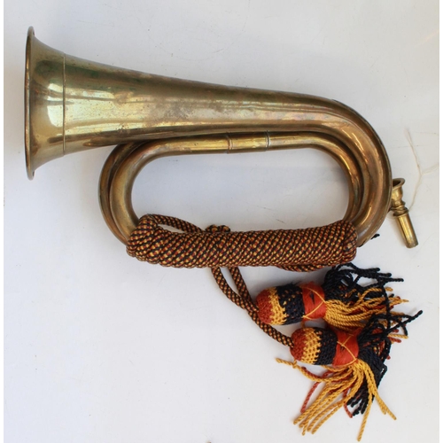 1406 - Pair of military bugles. Both with mouth pieces, bugle cords and tassels, one with The Royal Artille... 