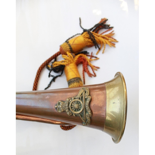 1406 - Pair of military bugles. Both with mouth pieces, bugle cords and tassels, one with The Royal Artille... 