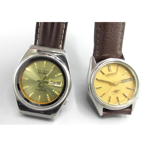 301 - Two Citizen Middle Eastern market stainless steel automatic wristwatches with day date, nos. 2120021... 