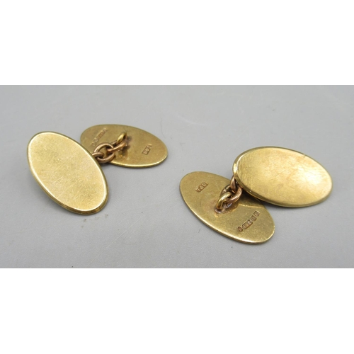 1099 - Pair of 9ct yellow gold oval cufflinks with engine turned detail, stamped 375, 7.75g