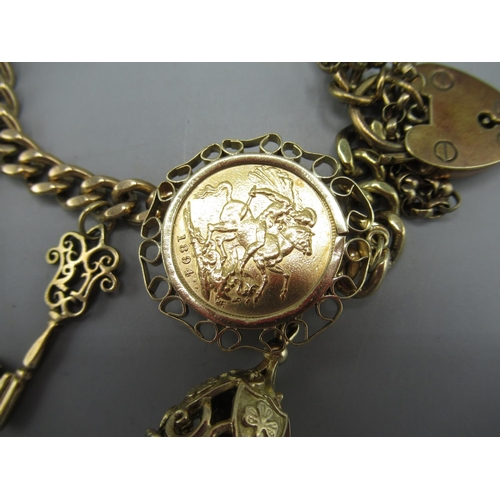 201 - 9ct yellow gold charm bracelet set with 9ct yellow gold charms and a 1894 sovereign in yellow metal ... 