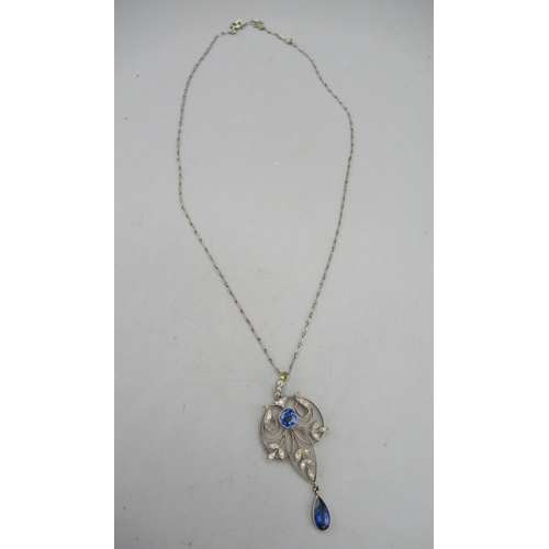 202 - Edwardian yellow and white metal open work drop pendant, set with sapphires and diamonds, on white m... 