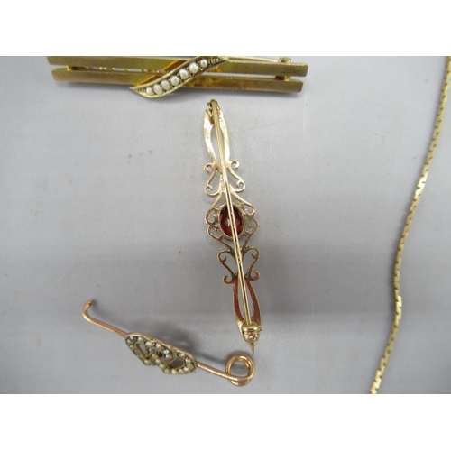 207 - 9ct gold bar brooch set with red stone, another gold bar brooch set with pearls, stamped 9ct, a yell... 