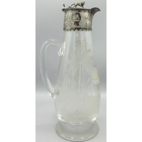 196 - Victorian cut glass claret jug engraved with a swan in a tropical scene, silver mount engraved with ... 