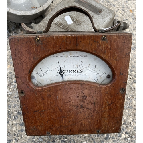 1359 - Vintage wooden-cased volt meter, a railway lamp with signs of damage, and a Venner time switch