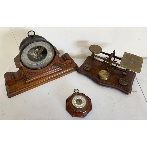 186 - Reynolds & Branson of Leeds Holosteric barometer with carved oak stand, a small Aneroid barometer, a... 