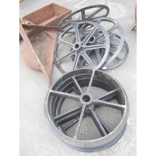 1264 - Two sets of Shepherd Hut cast iron wheels. Four spoke, 61cm. Seven spoke 67cm