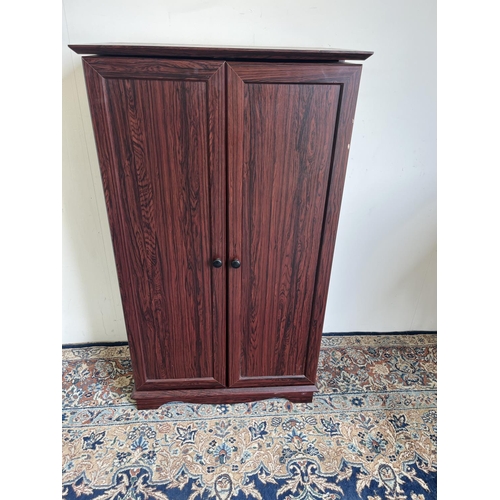 1172 - Mahogany finish double door CD / DVD storage unit, W61cm D34.5cm H106cm