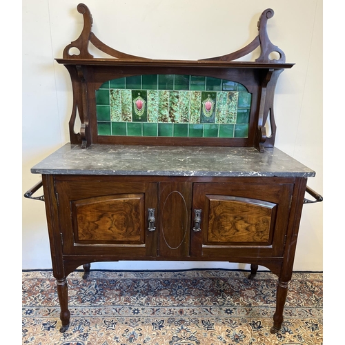 217 - Edwardian walnut washstand, with tiled back and grey marble top above two doors on turned supports, ... 