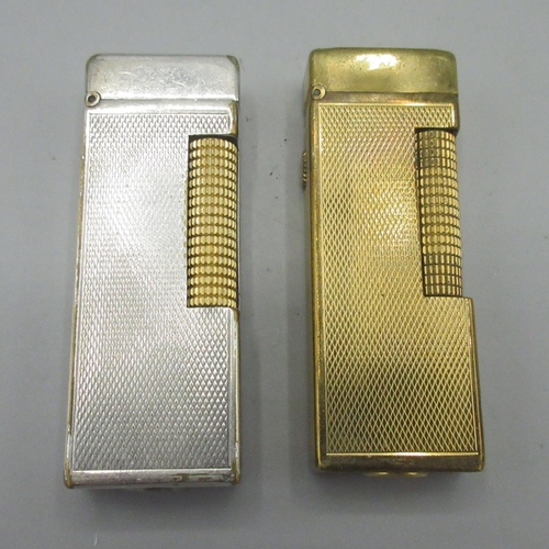 172 - Dunhill Patented gold plated butane cigarette lighter, engine turned decoration and similar silver p... 