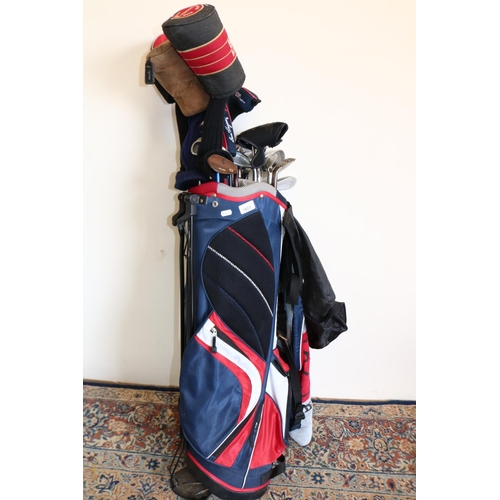 1023 - Set of golf clubs, mostly Callaway irons with two Big Bertha Drivers, some with club head covers, in... 