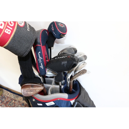 1023 - Set of golf clubs, mostly Callaway irons with two Big Bertha Drivers, some with club head covers, in... 