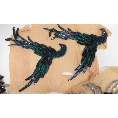 253 - Early 20th century and later haberdasheries sequin appliques in the form of exotic birds, butterflie... 