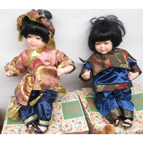 276 - Two Leonardo Collection Chinese style dolls, and a collection of soft toys including Roland rat and ... 