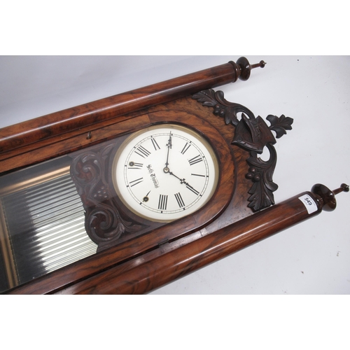 549 - Seth Thomas 8 day walnut wall clock, full length glazed panel door enclosing 8 1/4