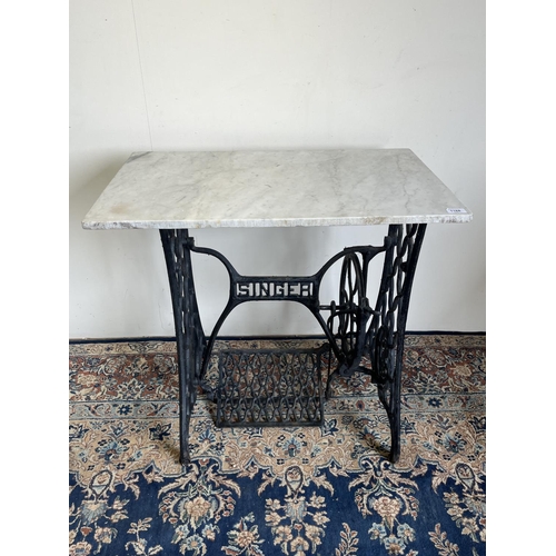 1168 - Singer sewing machine base with marble top, W78cm D46cm H74cm