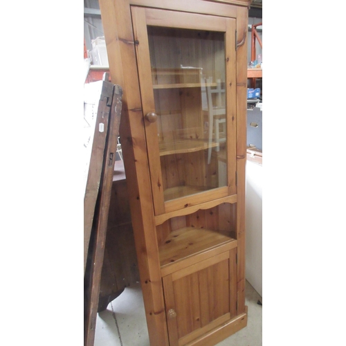 1249 - Pine corner cabinet with glazed and panel doors on a skirted base, W76cm D38cm H200cm