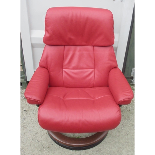 648 - Stressless red leather upholstered arm chair and matching stool