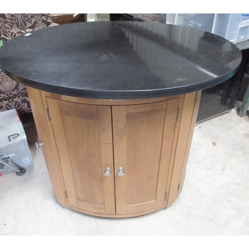 754 - Contemporary oak oval Island kitchen unit, with black granite top on four door base, W116cm D92cm H9... 