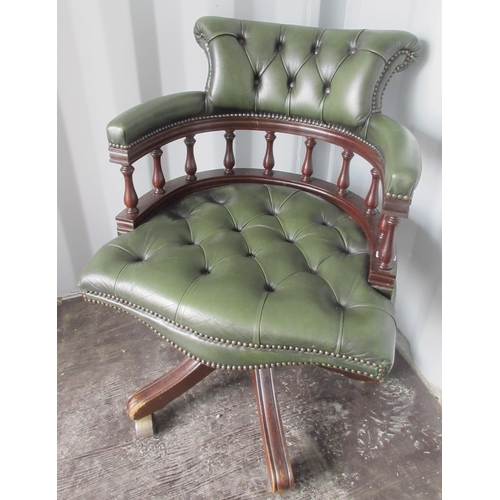 1255 - 20th century Captains type swivel open arm chair, green leather upholstered on four outsplayed suppo... 