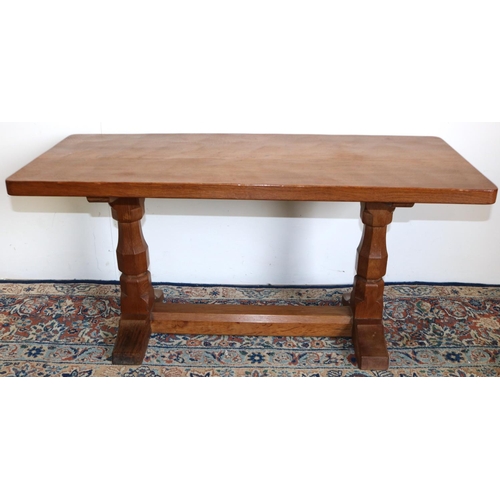 193 - Robert Mouseman Thompson of Kilburn - an oak rectangular coffee table, adzed top on octagonal balust... 