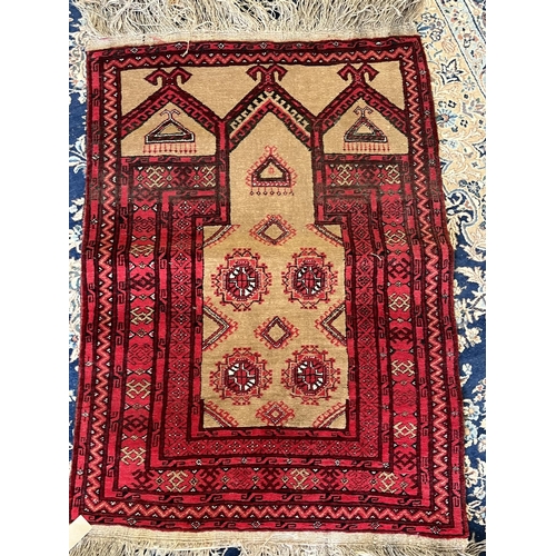 1245 - Small Persian pattern red ground Prayer rug, geometric medallion field  in multi striped border