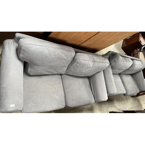 1250 - Pair of sofa with loose back and seat cushions in grey loose covers, on tapered supports, W185cm D82... 