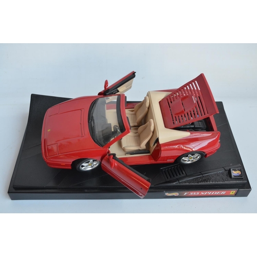 403 - Three 1/18th scale diecast Ferrari model cars from Hot Wheels to include F355 Spider, Dino 246GTS an... 