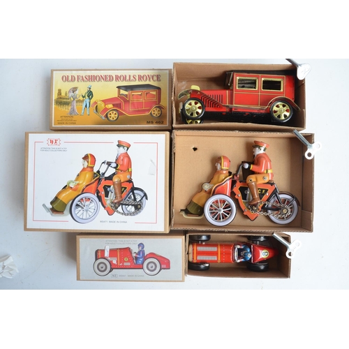 406 - Collection of modern tin plate clockwork and friction powered models to include a Schylling clockwor... 