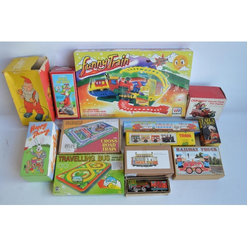 408 - Collection of modern tin plate clockwork and lever action models and similar toys to include a charm... 