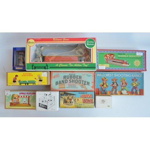 408 - Collection of modern tin plate clockwork and lever action models and similar toys to include a charm... 