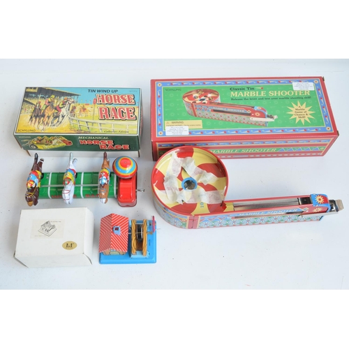 408 - Collection of modern tin plate clockwork and lever action models and similar toys to include a charm... 