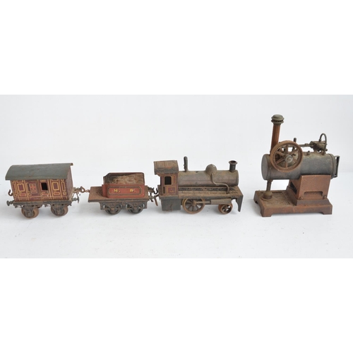 417 - Vintage live stationary steam engine stamped DRGM to rear and a vintage push along train model with ... 