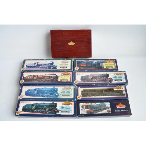 425 - Nine boxed OO gauge electric steam train models from Bachmann to include limited edition Green Arrow... 