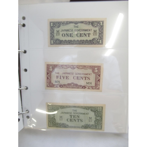 601 - Numis folder w/slip-case cont. various bank notes to inc. Military Currency 1 Yen, Japanese Governme... 