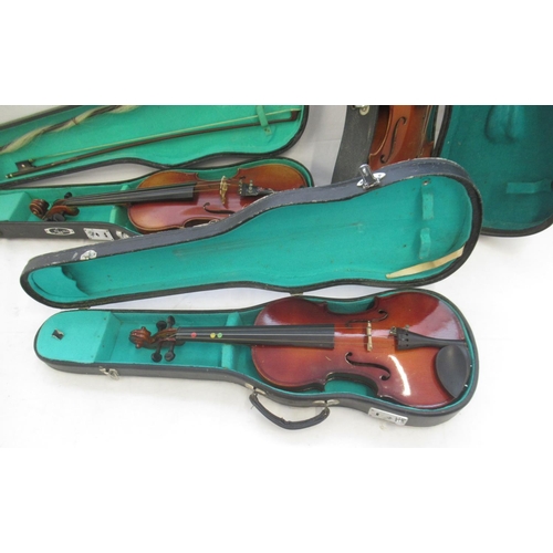 862 - Collection of 5 Chinese violins, some lacking bows and strings, all in individual cases