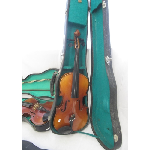 862 - Collection of 5 Chinese violins, some lacking bows and strings, all in individual cases