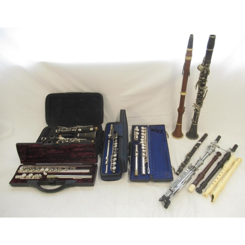 863 - Assorted collection of wind instruments to inc. cased Blessing flute, case Buffet Crampton flute, et... 