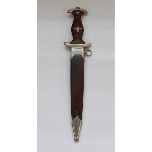 1565 - German War period 1933 Pattern SA Dagger. With Eagle symbol and Sa rune inset in handle. Blade is in... 