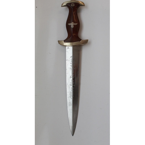 1565 - German War period 1933 Pattern SA Dagger. With Eagle symbol and Sa rune inset in handle. Blade is in... 