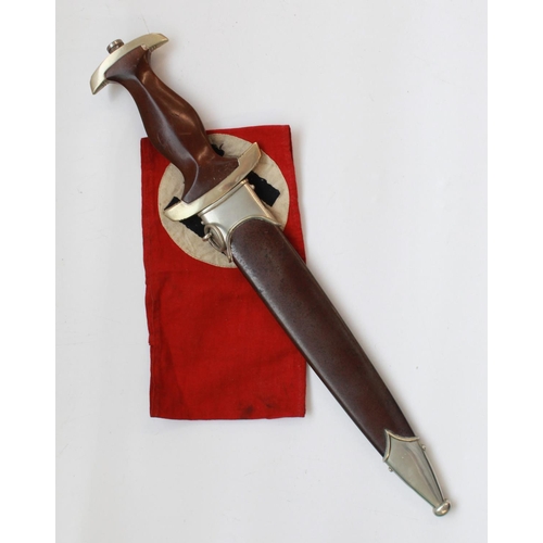 1565 - German War period 1933 Pattern SA Dagger. With Eagle symbol and Sa rune inset in handle. Blade is in... 