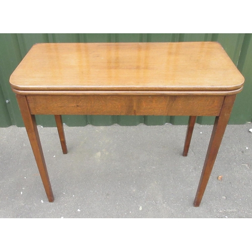 276 - Edwardian oak tea table, swivel folding top on square tapered supports, W92cm D90cm H74cm