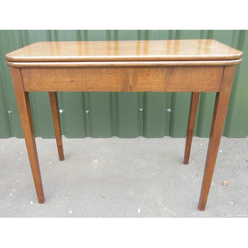 276 - Edwardian oak tea table, swivel folding top on square tapered supports, W92cm D90cm H74cm