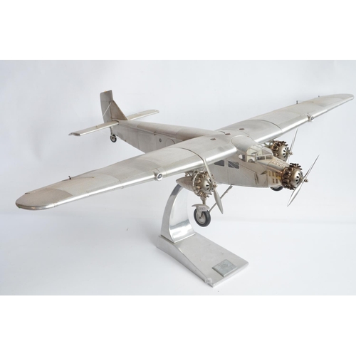 444 - Large museum standard Ford Trimotor static model aircraft model with solid polished metal stand by A... 