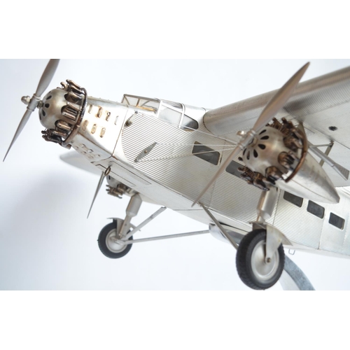 444 - Large museum standard Ford Trimotor static model aircraft model with solid polished metal stand by A... 