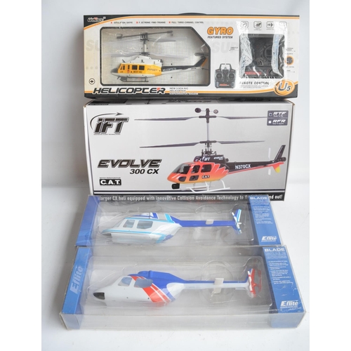 466 - IFT Evolve 300CX and U5 radio controlled helicopter models plus 2 Jet Ranger spare plastic body shel... 