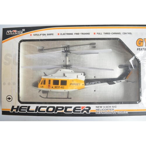 466 - IFT Evolve 300CX and U5 radio controlled helicopter models plus 2 Jet Ranger spare plastic body shel... 