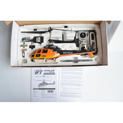 466 - IFT Evolve 300CX and U5 radio controlled helicopter models plus 2 Jet Ranger spare plastic body shel... 